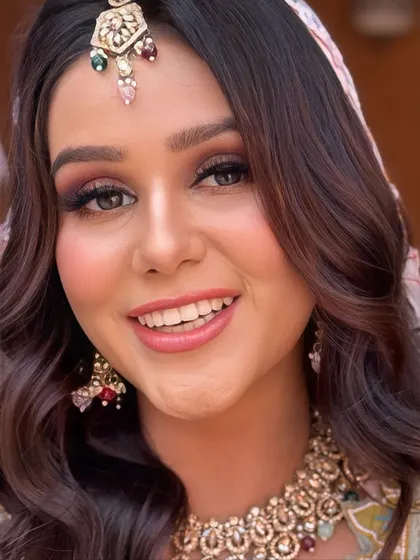 A bright, smiling portrait. This look is all about celebrating and having fun, and the makeup is designed to match that energy.