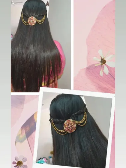 A sleek, straight hairstyle with a touch of elegance. I added a small braid and a decorative accessory to this half-updo for a polished finish.