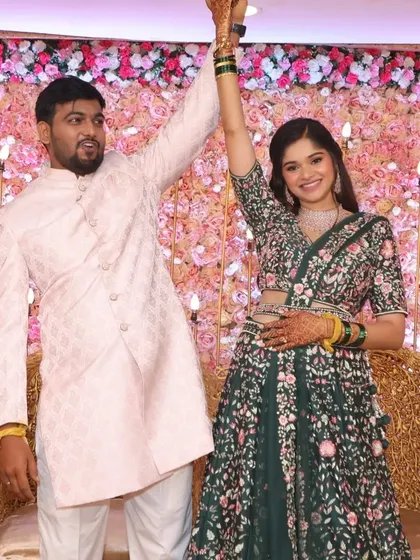 A joyful moment from their engagement party. Her makeup is designed to look flawless both in person and in photos, capturing her happiness perfectly.