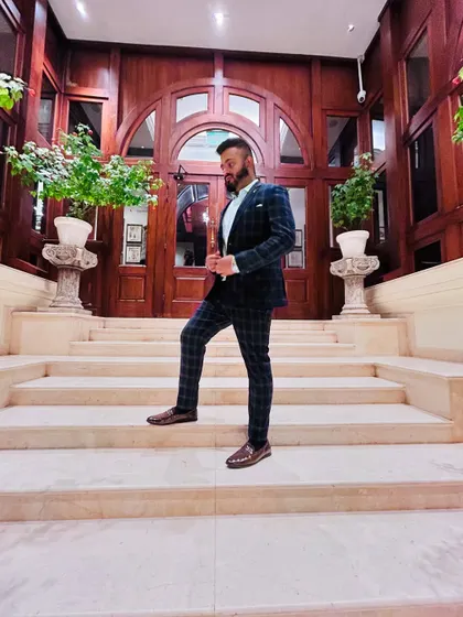 Another angle, same sharp look. I'm ready to bring class and energy to your wedding.