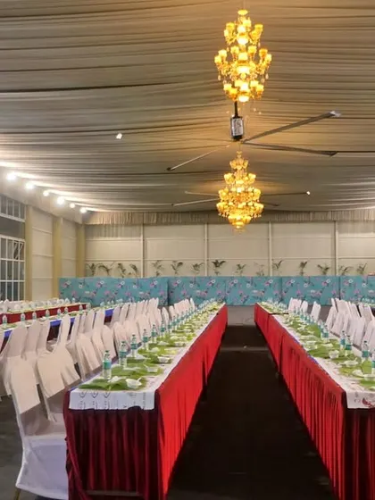 An empty hall prepared for a grand feast. This showcases the scale and precision of our setup for large events at venues like Palace Grounds.