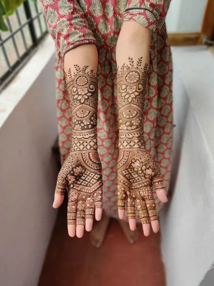 A full view of a mature bridal stain, showing the consistent dark color from the palms to the forearms.