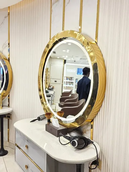 Luxury redefined. A look at one of my styling stations, complete with a golden mirror and elegant design, ready for your transformation.