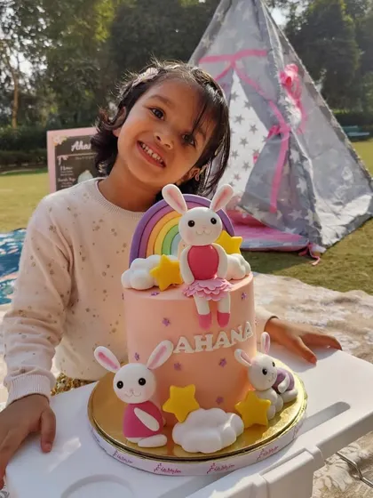That smile says it all. It's pure joy to see a child so happy with their custom-designed bunny and rainbow birthday cake. These are the moments I bake for.