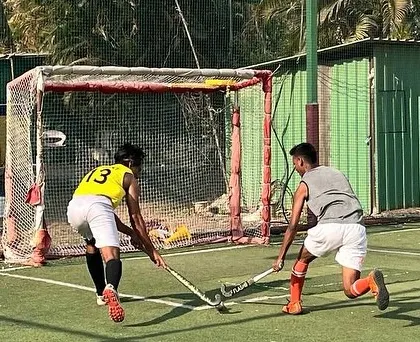 A one-on-one duel in front of the goal. This intense moment from a practice match showcases the competitive spirit we nurture in our players.