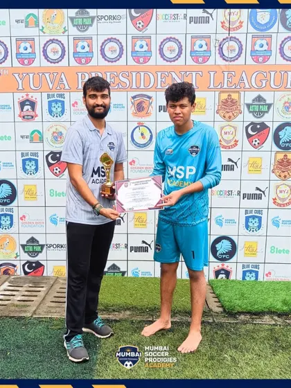 A player receives the Player of the Match award after our U15s' 2-1 quarter-final win.