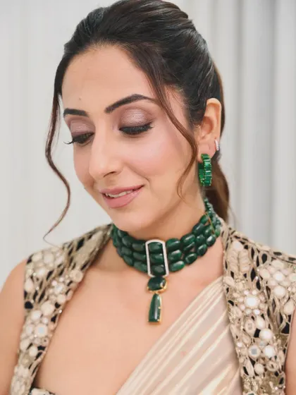 For this shoot with Nykaa, I styled a simple, elegant ponytail with a few soft tendrils to frame the face. The style is clean and allows the focus to be on the makeup and stunning jewelry.