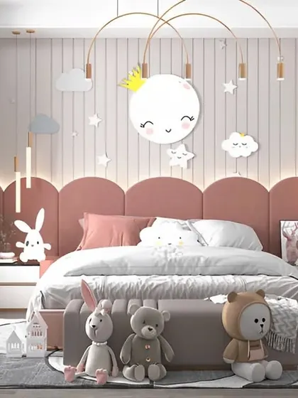 This lovely kids' room features a soft pink color palette and a celestial theme. We designed the space with a cute moon-and-stars light fixture, a comfortable bed, and plenty of plush toys to create a cozy and imaginative environment.