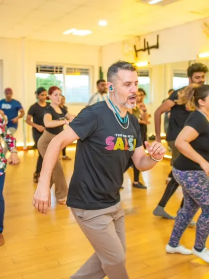 A wide shot of the workshop in progress. You can see a full room of dancers, all focused on learning from Diego and Sofia. The collective energy was amazing.