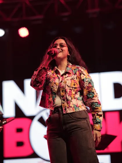 A close-up shot of me singing my heart out in Ahmedabad. Connecting with a live audience and feeling their energy is the best part of being a performer.