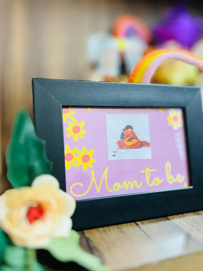 I often include personalized keepsakes like this framed "Mom to be" picture. It's a sweet memento that she can cherish long after the baby arrives.