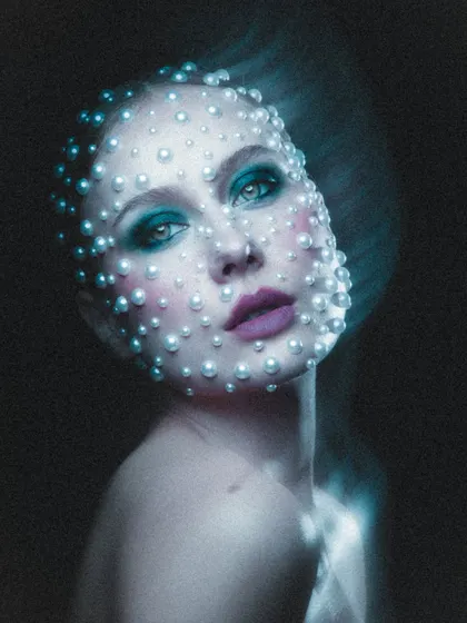 This celestial-inspired look is one of my favorites. We spent hours carefully placing each pearl to create this ethereal, otherworldly effect for a high-concept beauty portrait.