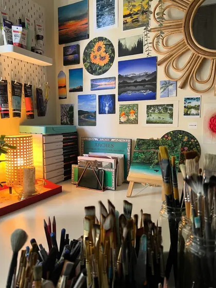 A wide shot of my desk, showing the organized chaos of an artist's workspace. Every brush and paint tube has its place.