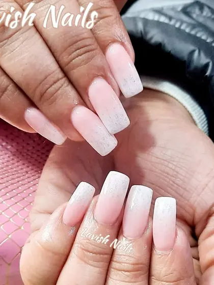 A soft ombré with a hint of shimmer in the white tips, adding a subtle touch of sparkle to the classic gradient look.