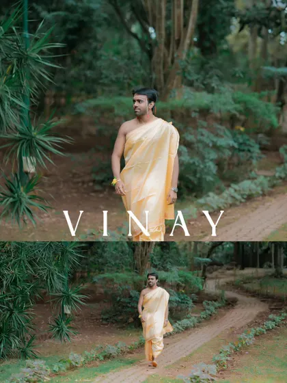 A portrait of the groom during his Kashi Yatra, walking along a path in a lush green environment, symbolizing his journey towards marriage.