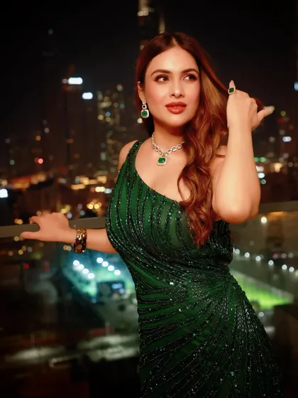 A glitter and glam look I styled for Neha Malik for an event in Dubai. This emerald green sequin gown with a dramatic train was perfect for a night out, set against the stunning backdrop of the Burj Khalifa.