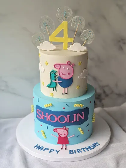 This time, it's all about George and his favorite dinosaur. This two-tier Peppa Pig cake is a fun and colorful creation for a 4th birthday.