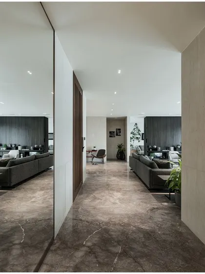 The reflection in the mirror provides a framed view of the living room, demonstrating how I use reflective surfaces to create interesting visual layers within a home.