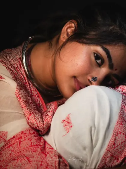 A closer crop of the intimate portrait, focusing on the eyes. The makeup is subtle, with just enough definition.