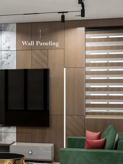 For this living area, I focused on creating a statement space that was also livable. The design features dramatic wall paneling combining wood and marble, a floating TV unit, and modern track lights for a functional yet impressive result.