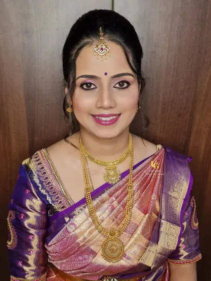 A beautiful portrait of Aparna, showcasing her complete traditional look. Her smile radiates happiness and confidence.