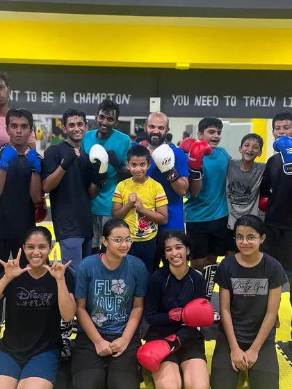 A great mix of our members, with our female and junior athletes smiling for a group photo after a tough boxing session.