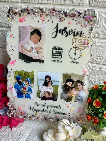 The white base makes the photos and black text pop, ensuring all the important birth details are clear and easy to read.