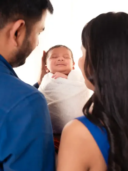 A newborn's smile is pure magic. We capture these fleeting moments for you to cherish forever.