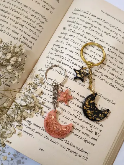 These moon and star keychains are so dreamy. I offer them in different colors, like this set in soft pink with rose gold flakes and black with gold flakes.
