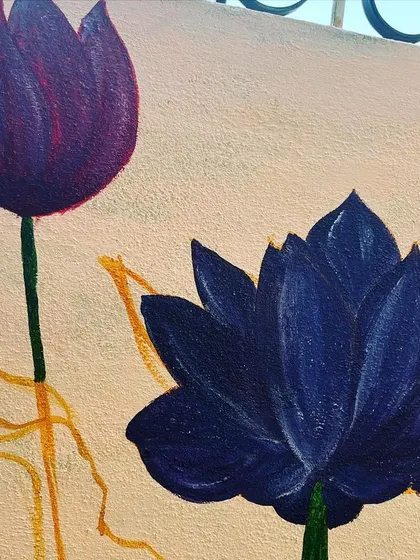 A close up detail of the lotus mural. You can see the layering of colours used to create the deep purple petals of the lotus flower, adding depth and realism to the wall art.
