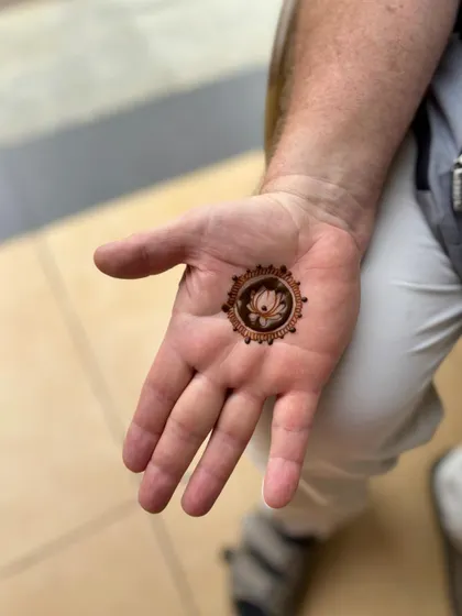 A simple lotus mandala, a perfect first-time henna experience for this client.