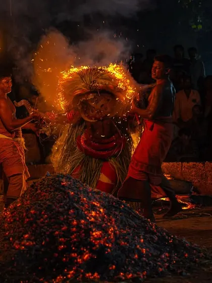 A series capturing the different stages of the Pottan Theyyam ritual, from the performer lying on the embers to being tended to by assistants. These images show the intensity and devotion involved in the all-night ceremony.