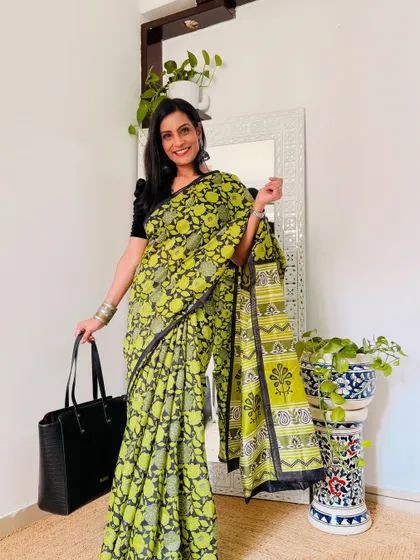I love the fresh color combination of this lime green and black printed saree. It's a cheerful yet professional option for your work wardrobe.