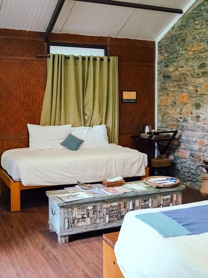 Our rooms feature a blend of natural materials like stone and wood, creating a warm and inviting atmosphere for a restful stay.