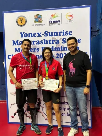 Another proud moment, receiving the award for the mixed doubles win at the Thane championship.