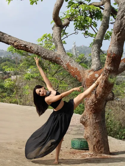 In my element, practicing a standing split variation using a tree for support. Nature is the best yoga prop.
