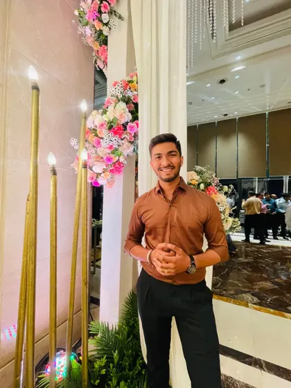 A photo of me at a wedding event. I believe in looking sharp and professional while getting ready for a performance.