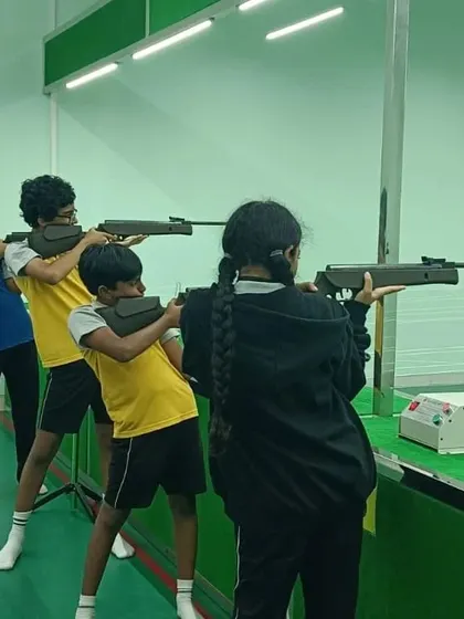 A group of students learning the basics of handling an air rifle. Group sessions are a great way for kids to learn together in a structured and safe environment.