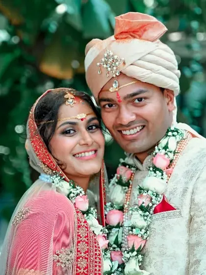 A happy portrait of a newly married couple, their smiles showing the joy of the moment.
