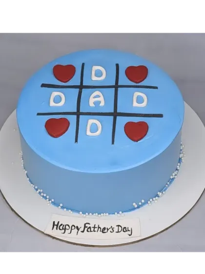 A tic-tac-toe cake for Dad. This simple and creative chocolate truffle cake is a fun way to celebrate Father's Day.