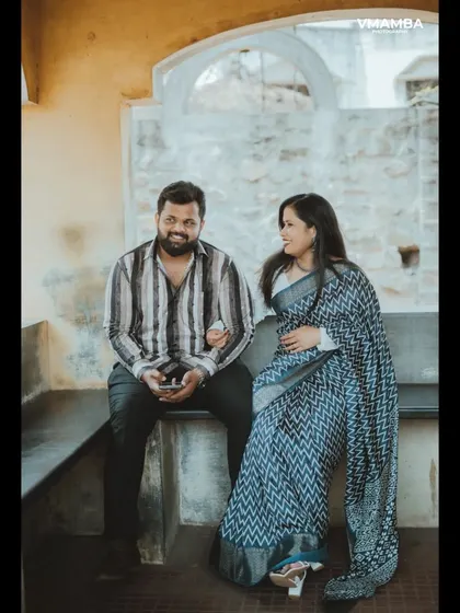 A relaxed and candid moment of a couple sharing a laugh. Our pre-wedding sessions are all about capturing your natural chemistry.