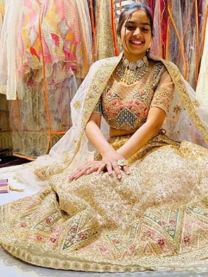 Feel like a million bucks in this heavily embroidered gold lehenga. It’s perfect for a bride who wants a truly grand and opulent look for her reception.