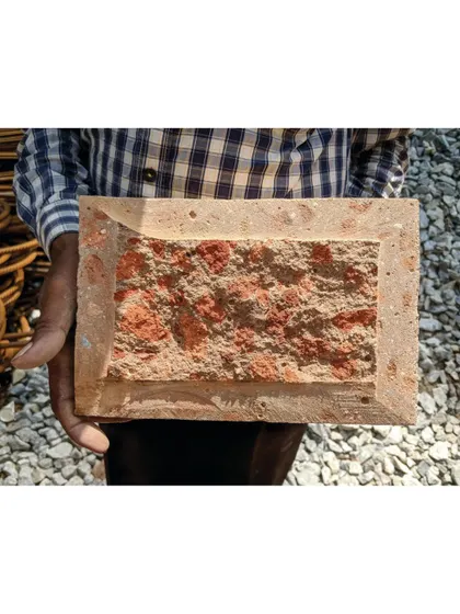 This is the story behind our Debris Block House. We developed a unique, sustainable building material by creating mud blocks from the debris of the original structure on the site, revealing a hidden texture when cut open.