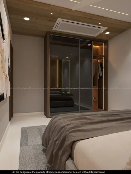 A wider view of the guest bedroom, showing how the wardrobe complements the room's wooden ceiling and neutral walls.