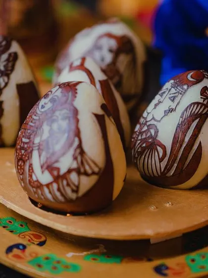 A close-up of henna-painted coconuts, a unique and artistic detail we created for a traditional Varapooja ceremony.