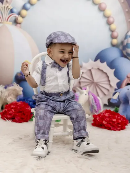 Lost in a world of fun and fantasy. This candid shot captures the pure joy of a child's imagination during one of our themed birthday photoshoots.