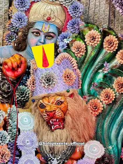 A detailed shot from the currency note pandal, showing other deities and figures that were part of the overall divine theme. The entire backdrop is a testament to detailed craftsmanship using unconventional materials.