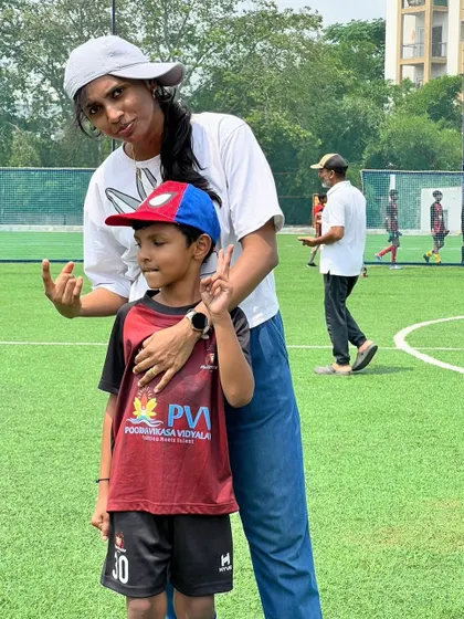 A proud parent moment. A mother and son pose together at our summer camp closing ceremony, celebrating a season of growth and fun.