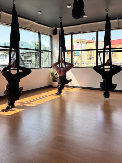 Another view of the inverted bound angle pose, showing the deep hip-opening benefits.