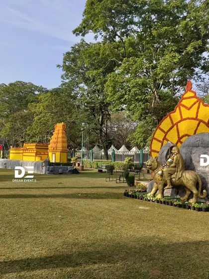 A wider view of the park, showing how my floral installations, like the temple and the statue backdrop, create a cohesive and immersive experience for visitors. Each piece is designed to complement the others and the surrounding environment.
